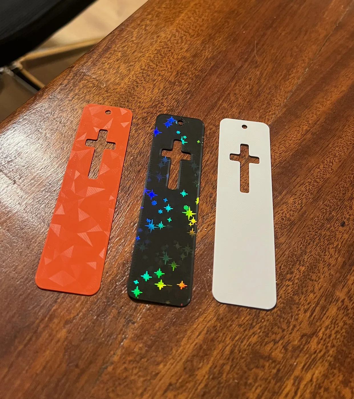 3D printed cross bookmarks in three finishes