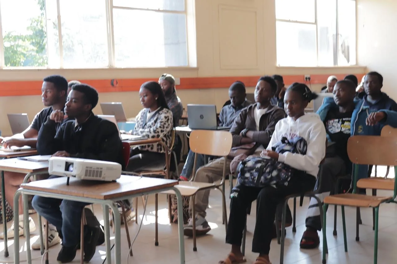 Students learning 3D printing in a Layerzim workshop